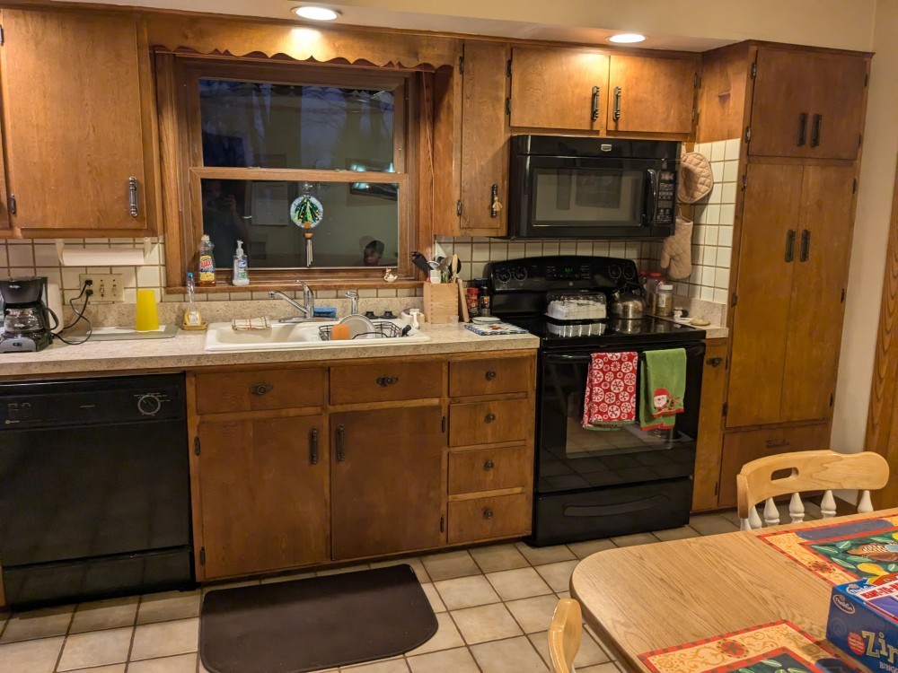 A modern kitchen with stainless steel appliances.